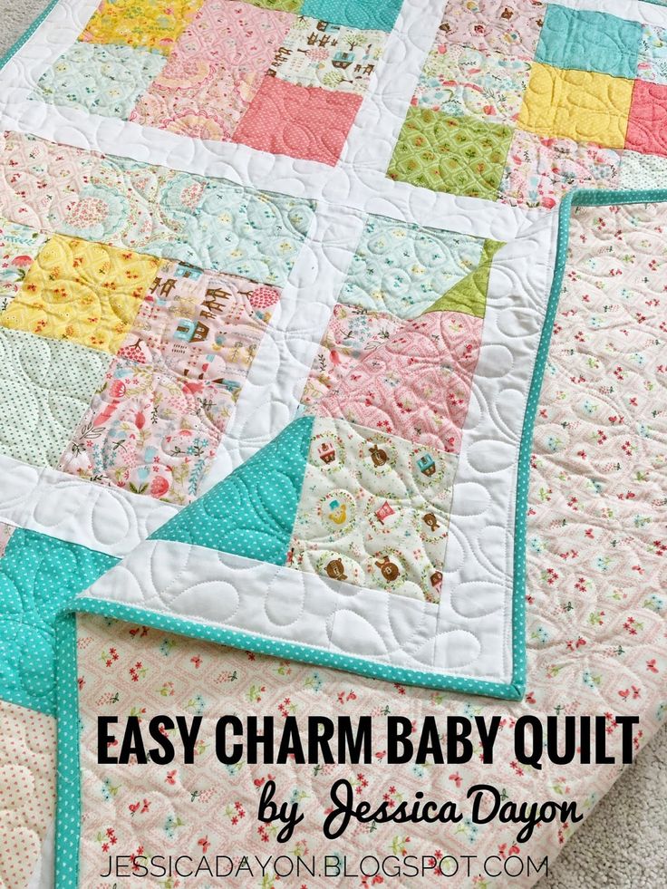 the easy charm baby quilt is on display