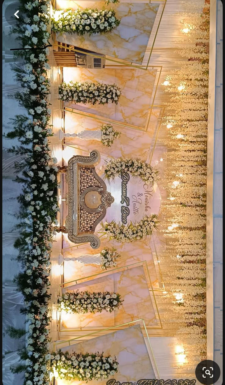 an overhead view of a wedding ceremony with white flowers and candles on the sidelines