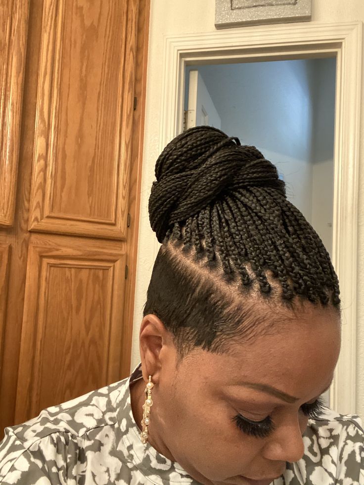 Pin by Linda Christopher on haircut | Braids with shaved sides, Shaved side hairstyles, Braided cornrow hairstyles Braided Cornrow Hairstyles With Shaved Sides, Knotless Braids With Tapered Sides, Braids With Shaved Sides And Back, Micro Braids With Shaved Sides, Braid Mohawk For Black Women, Cornrows With Shaved Sides, Braids With Undercut Black Women, Mohawk Braids For Black Women, Braids For Short Hair Black Women