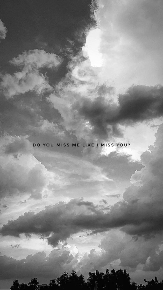 black and white photograph of clouds with the words do you miss me like i miss you?