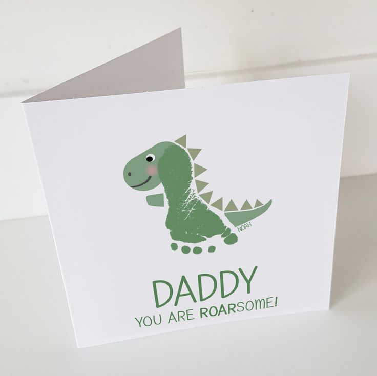 a greeting card with a green dinosaur on it's back and the words daddy you are roarsome