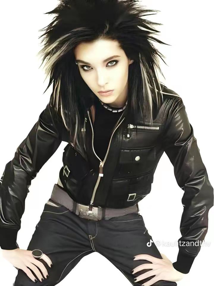 a woman with black hair and leather jacket