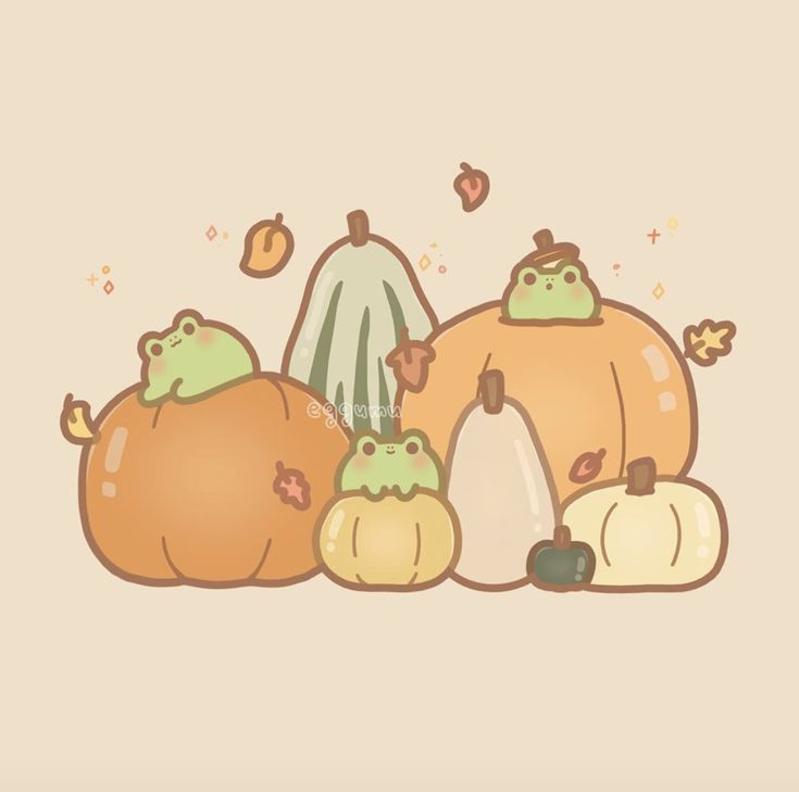 a group of pumpkins sitting next to each other