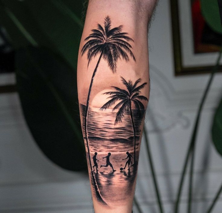 a man's arm with a palm tree and surfers on the beach