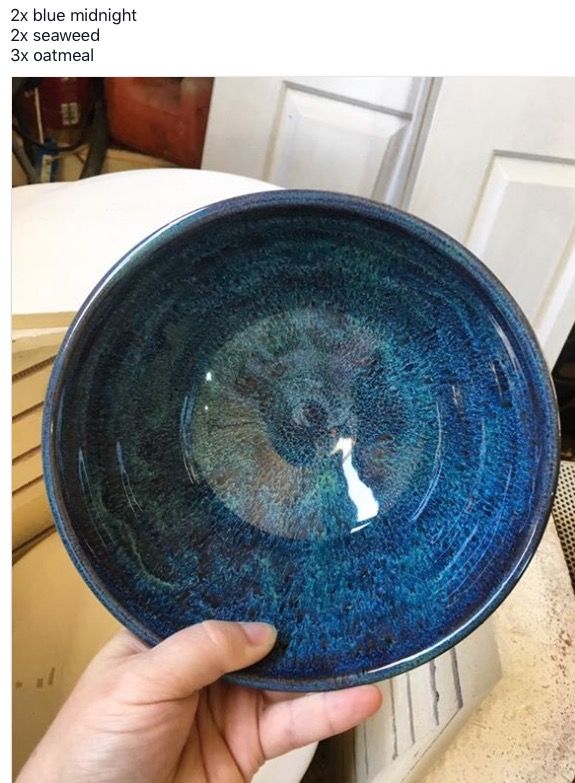 a person holding a blue bowl in their hand