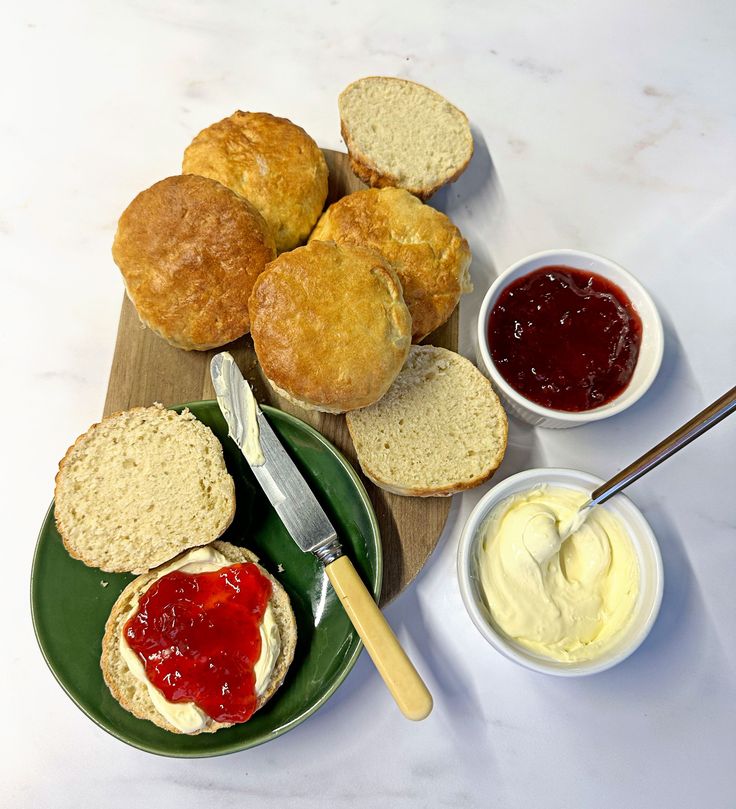 bread, jelly and jam on a green plate