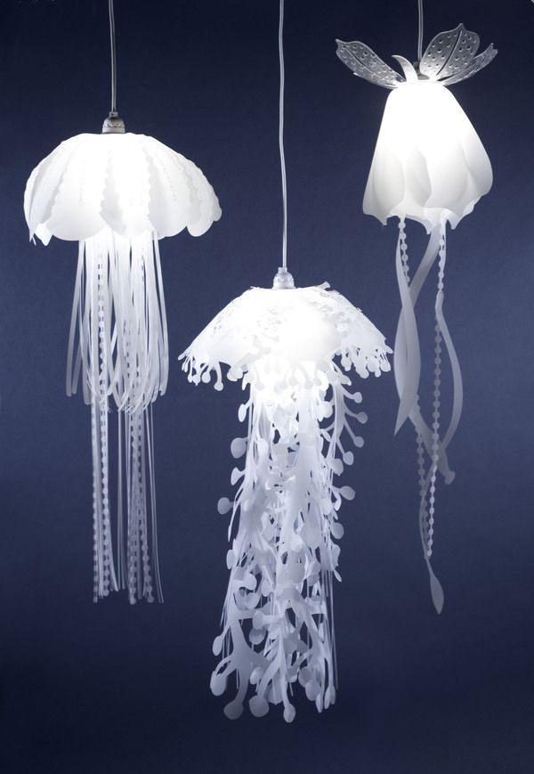 three white jellyfish lights hanging from strings