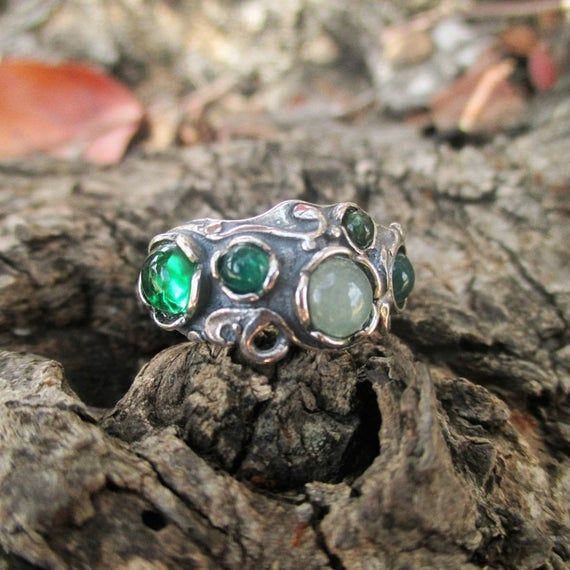 From Porans collection----> Unique Sterling Silver Ring with 5 gemstones (green onyx, aventurine and green quartz).Dimensions:Max Width:0.4 inchesCan be any size you need.available with many other stones!Please contact me with any question.our jewelry shop on Etsy: http://www.etsy.com/shop/PoransThank you for Visiting Our shopPlease visit my shop policies for additional information Green Gemstone Sterling Silver Birthstone Ring, Green Sterling Silver Stackable Rings For May Birthstone, Green Multi-stone Stackable Rings For Anniversary, Green Gemstone Stackable Rings In Sterling Silver, Green Multi-stone Rings For May Birthstone, Unique Sterling Silver Emerald Ring For May Birthstone, Unique Green Stackable Promise Rings, Green Multi-stone Emerald Ring For May Birthstone, Green Emerald Open Ring Stackable Rings