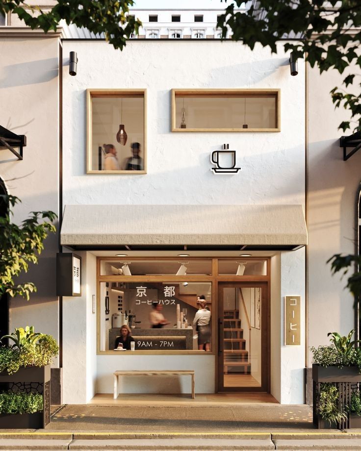 a coffee shop with two people in the window