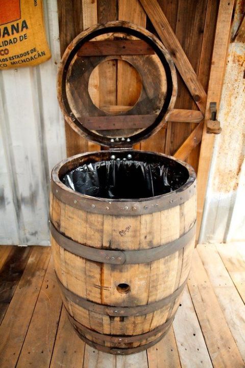 a wooden barrel sitting on top of a wooden floor