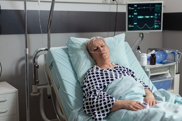 an older woman laying in a hospital bed