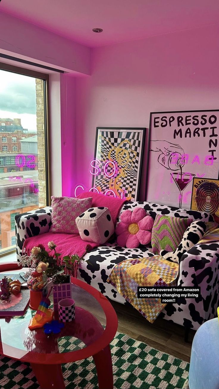 a living room filled with lots of colorful furniture and decor on top of a checkered floor