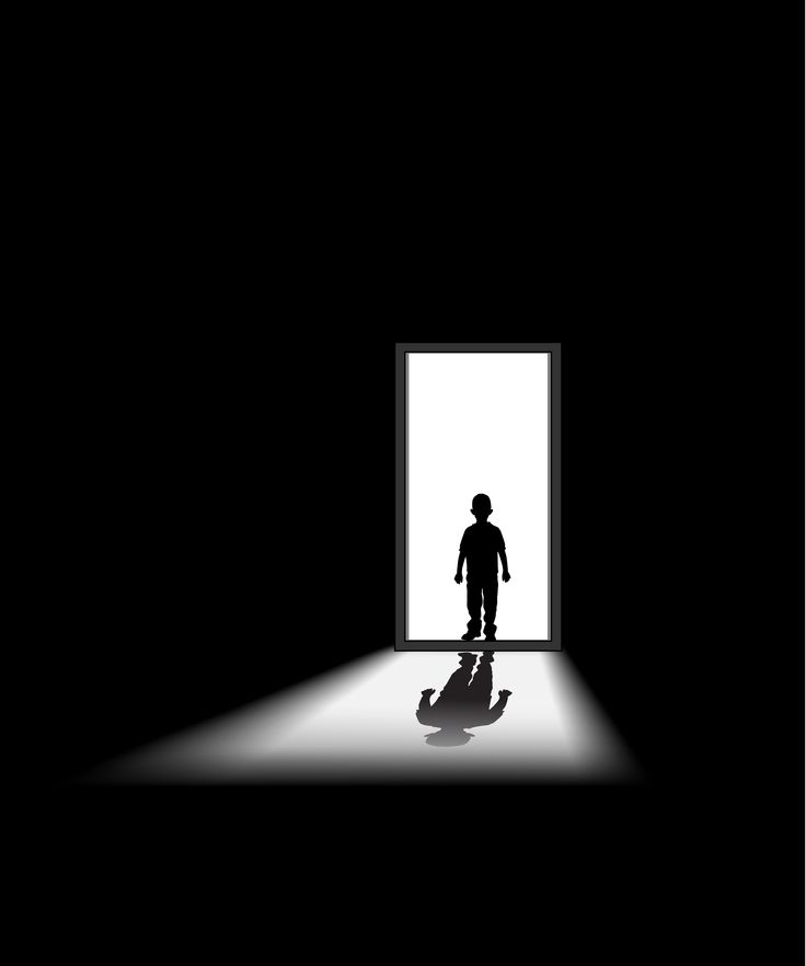 the silhouette of a person standing in front of an open door with light coming through