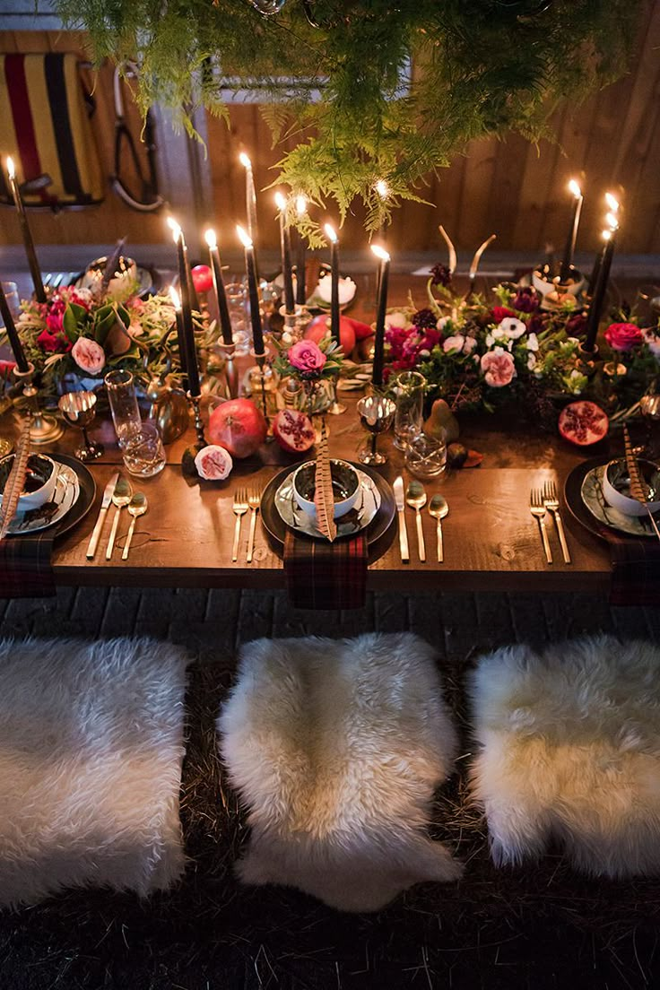 the table is set with candles and flowers