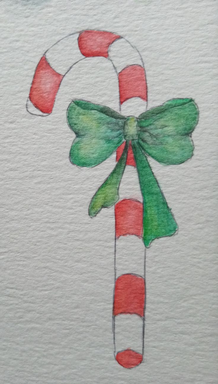 a watercolor drawing of a candy cane with green and red bows on it's tail