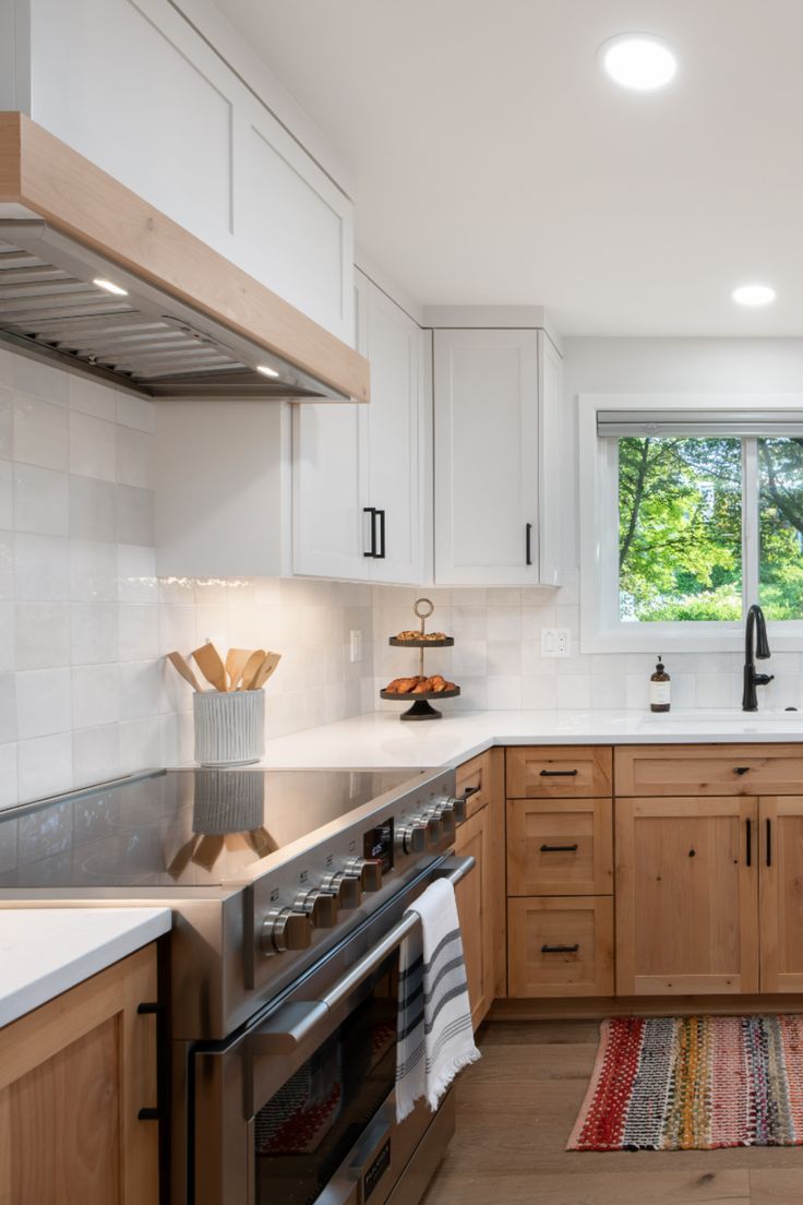 a kitchen with wooden cabinets and white counter tops