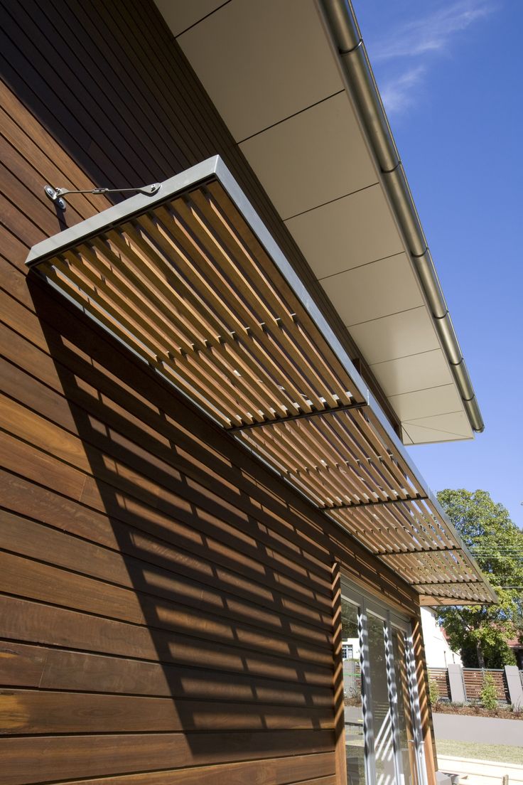 the side of a building with wooden slats on it