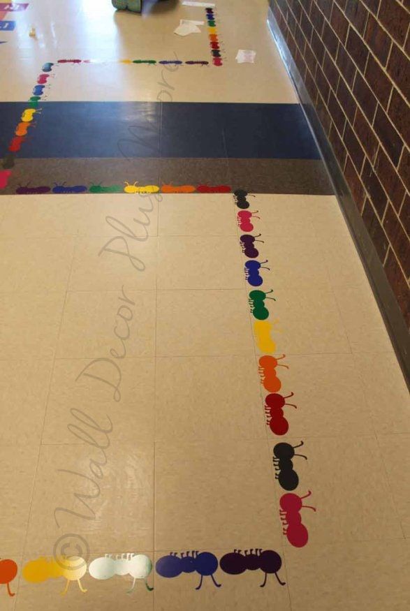 the floor is decorated with many different colored bugs and rainbows, all on it's own side