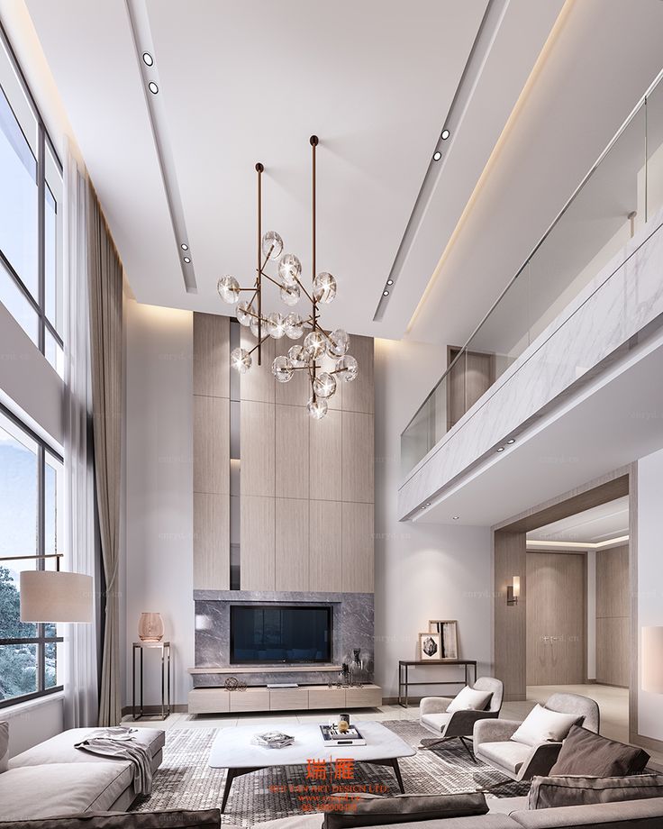 a modern living room with high ceilings and chandelier