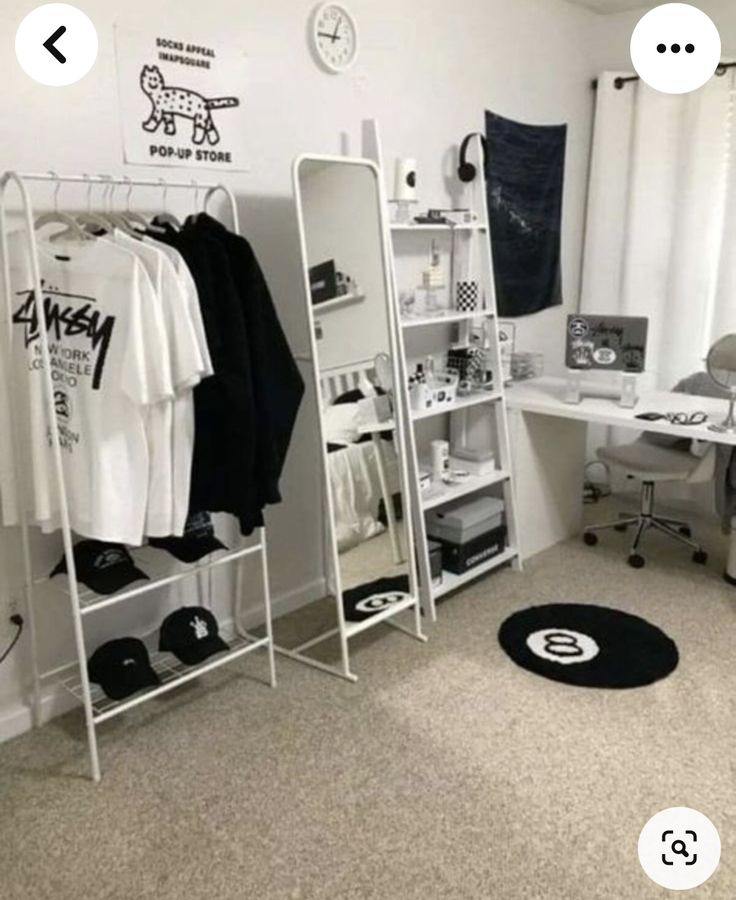 a white room with clothes on racks and other items