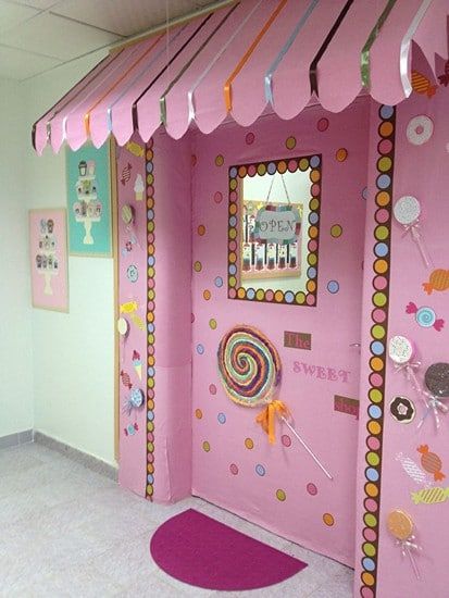 an image of a pink room with decorations on the walls and in the doorway is a classroom