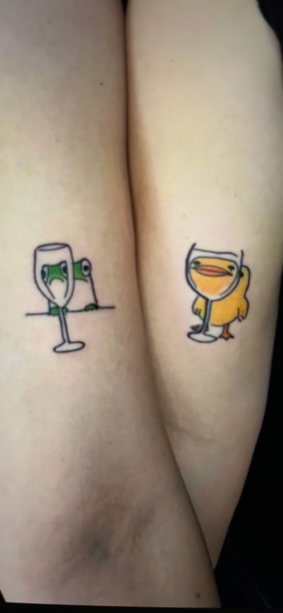 two tattoos on the legs of people with wine glasses