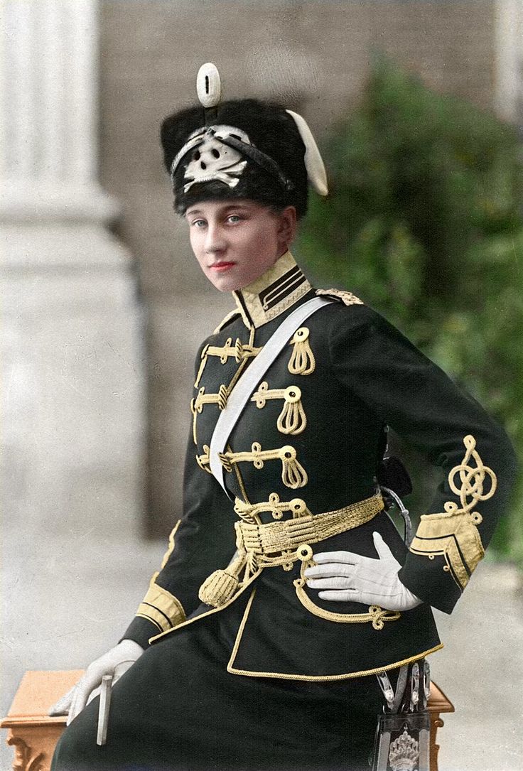 an old photo of a woman in uniform