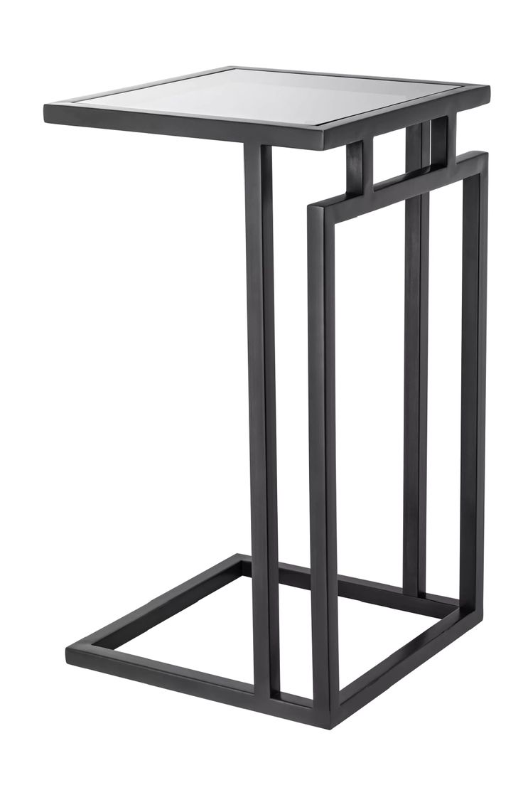 the side table is made from metal and has a square top with an iron frame