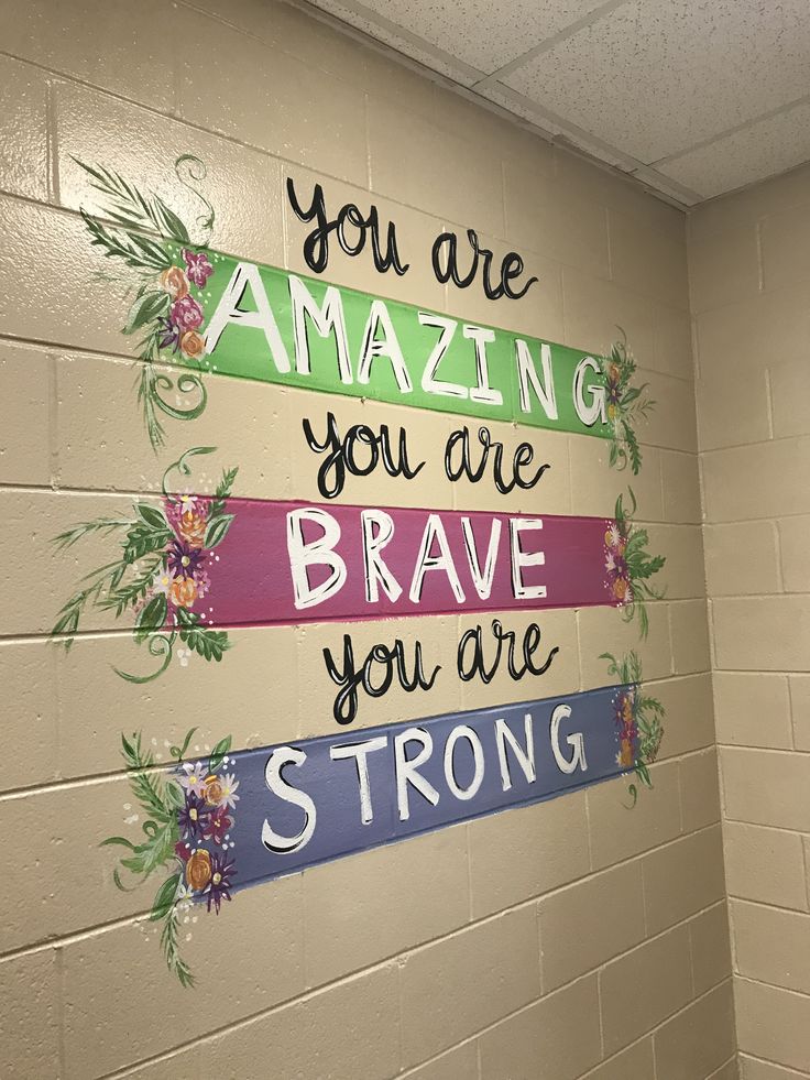 a wall with some writing on it that says, you are amazing you are brave you are strong