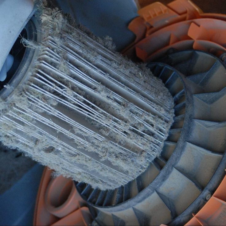 an old radiator sitting on top of a pile of dirt