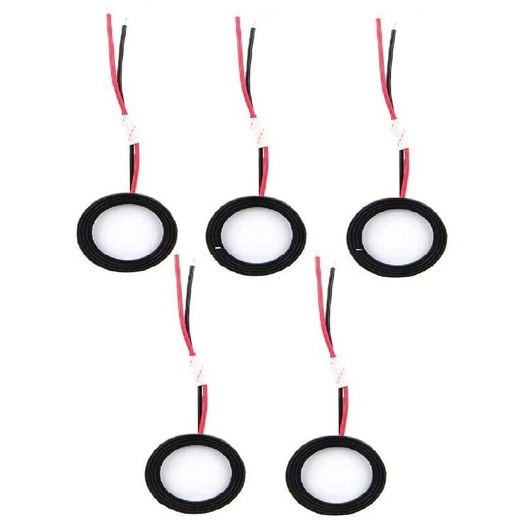 six black and white circles with wires attached to them