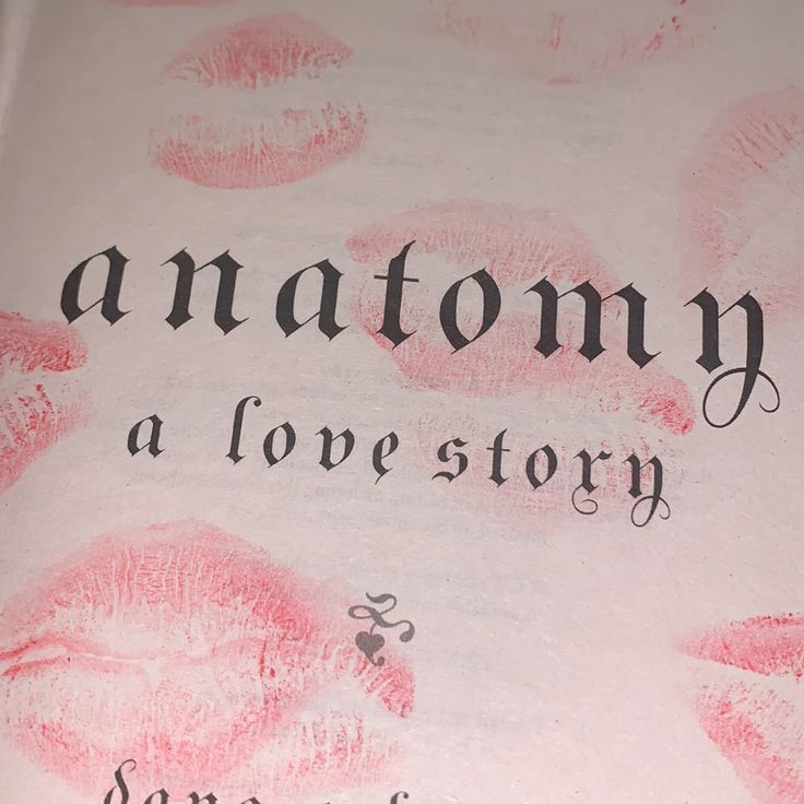 an open book with red lipstick imprints on the cover and writing that reads anatomy