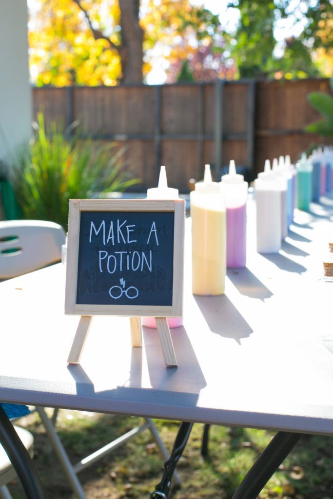 a sign that says make a potton on top of a table with milk bottles