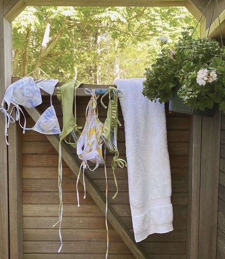 towels hanging on a clothes line outside in the sun