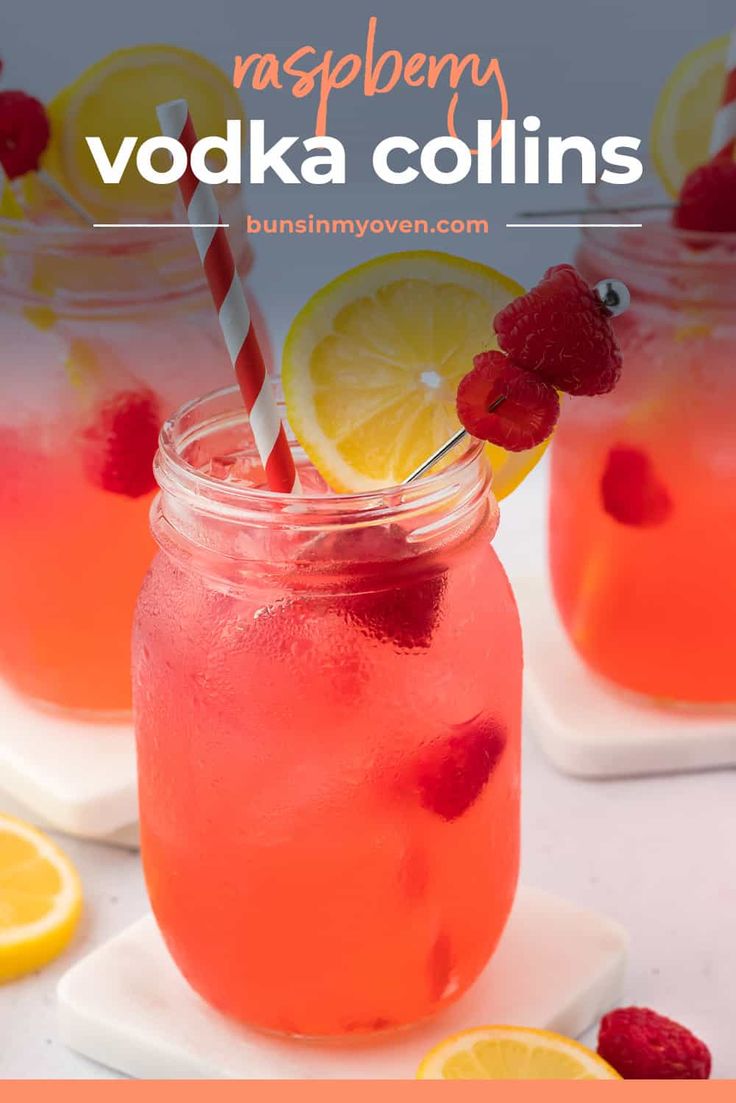 two glasses filled with raspberry vodka and lemonade garnished with strawberries