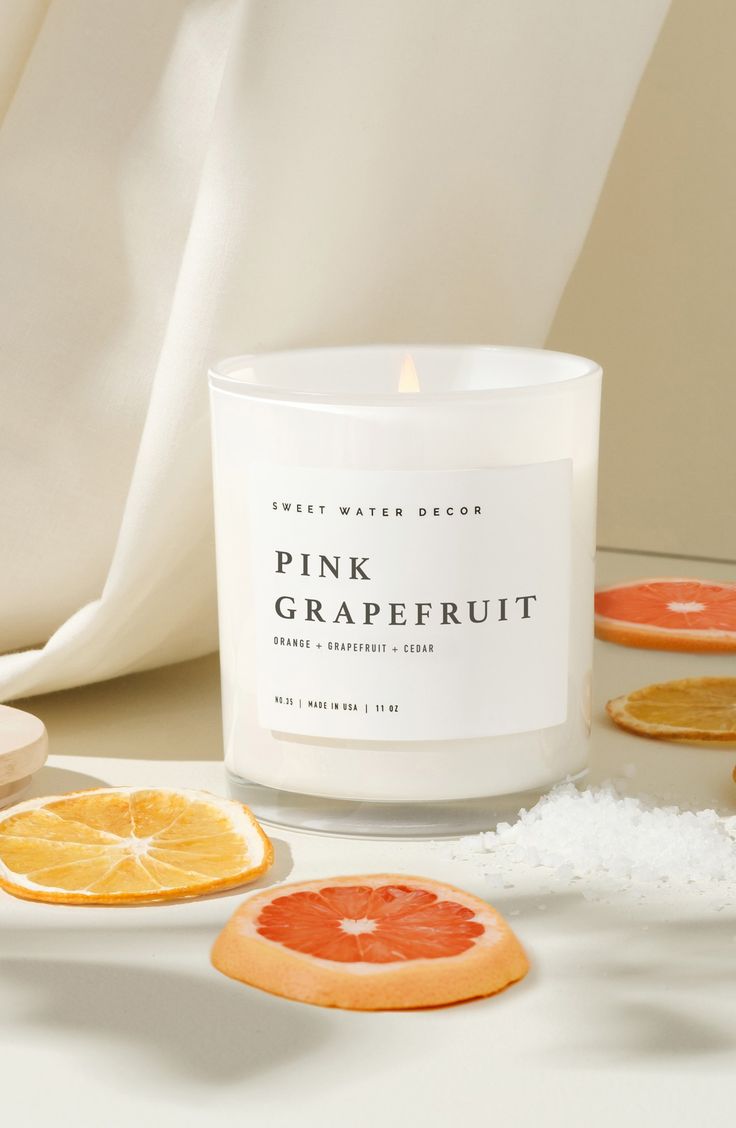 What it is: A luxe scented candle in a minimalist jar that adds personality and dreamy fragrance to your space. - Pink Grapefruit: A citrusy blend of grapefruit, orange, strawberry, jasmine and vanilla- Luxury Getaway: The perfect blend of leather, iris and sandalwood- Flower Shop: A sweet blend of jasmine, bergamot, pink peppercorn and rose 3" x 3" x 3.5" 11 oz. 50-hour approximate burn time Soy-wax blend/fragrance Made in the USA Water Decor, Pink Peppercorn, Sweet Water, Luxury Getaway, Pink Grapefruit, Jar Candle, Scented Candle, Flower Shop, Grapefruit