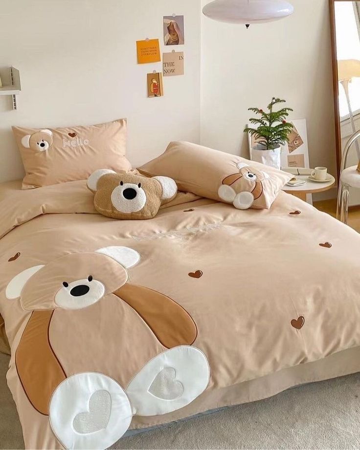 there is a bed with two teddy bears on it