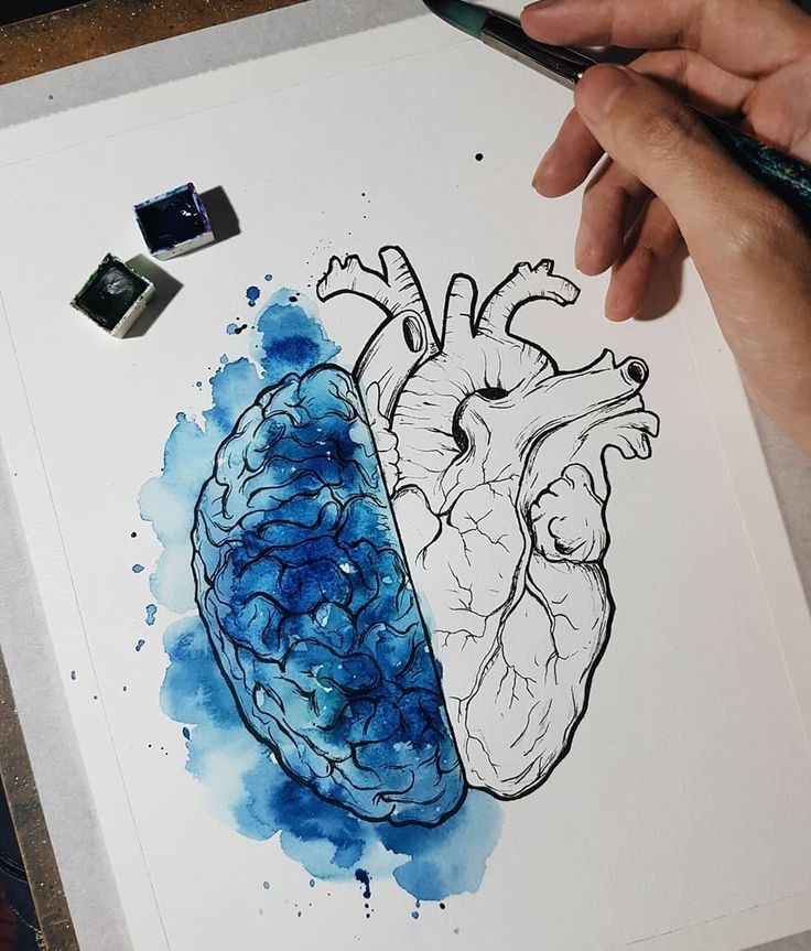 a drawing of a human heart next to a blue watercolor stain splattered image