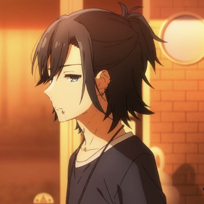 an anime character with black hair and blue eyes looking at something in the distance while standing next to a brick wall