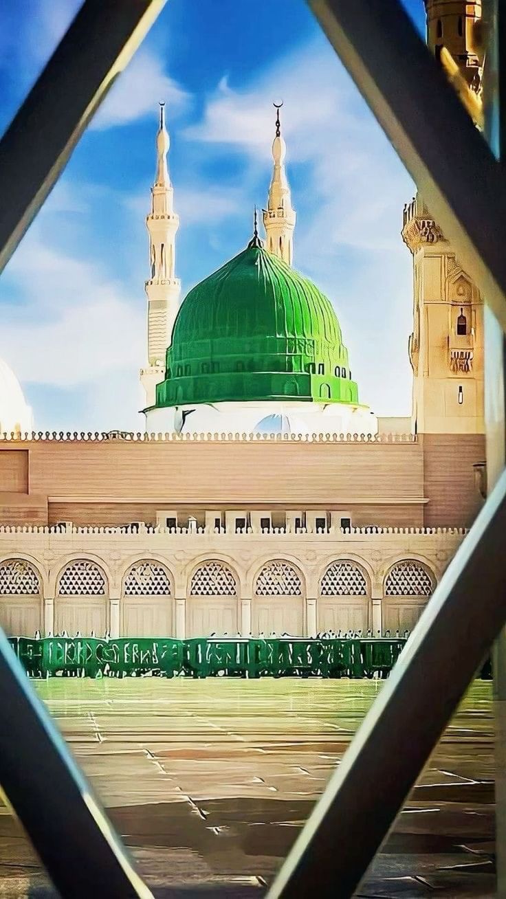 a view through a window at a building with a green dome