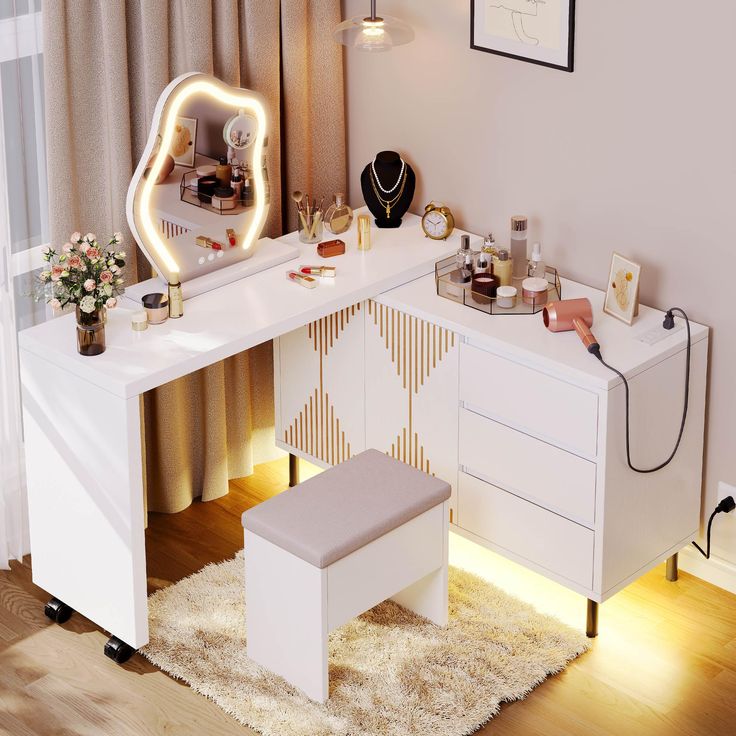 a white vanity with lighted mirror and stool