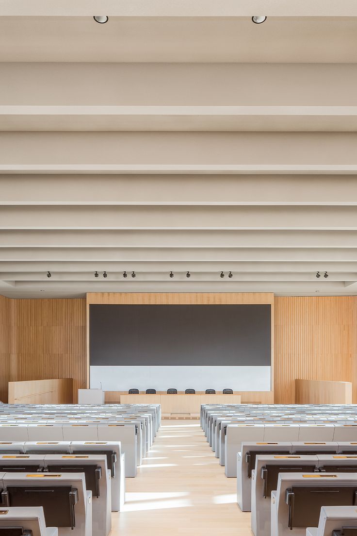 lecture hall interior design with acoustic ceiling and wooden wall panelling Lecture Hall, Lecture Hall Design Architecture, Lecture Hall Design, Auditorium Ceiling, Acoustic Diagram Architecture, Auditorium Acoustic Design, University Lecture Hall, Acoustic Wall Panels Auditorium, University Lectures