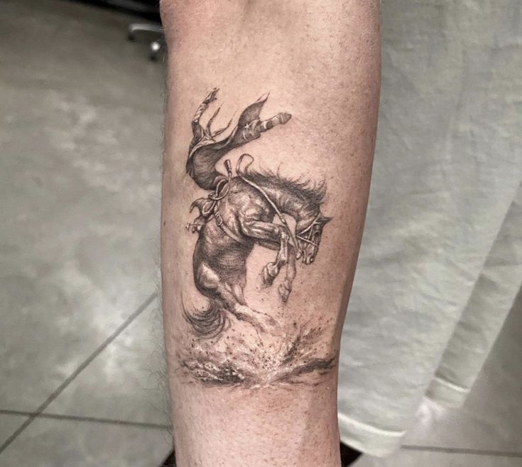 a tattoo on the leg of a person with a horse in it's body