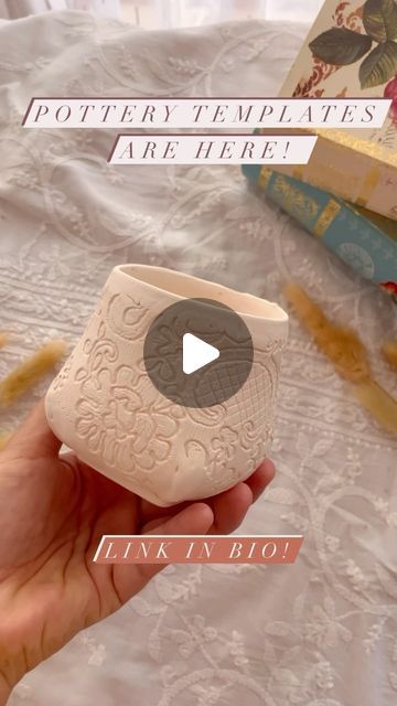 a person holding a white vase in their hand with the words pottery templates are here