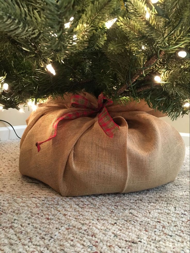 a bag wrapped in burlock under a christmas tree