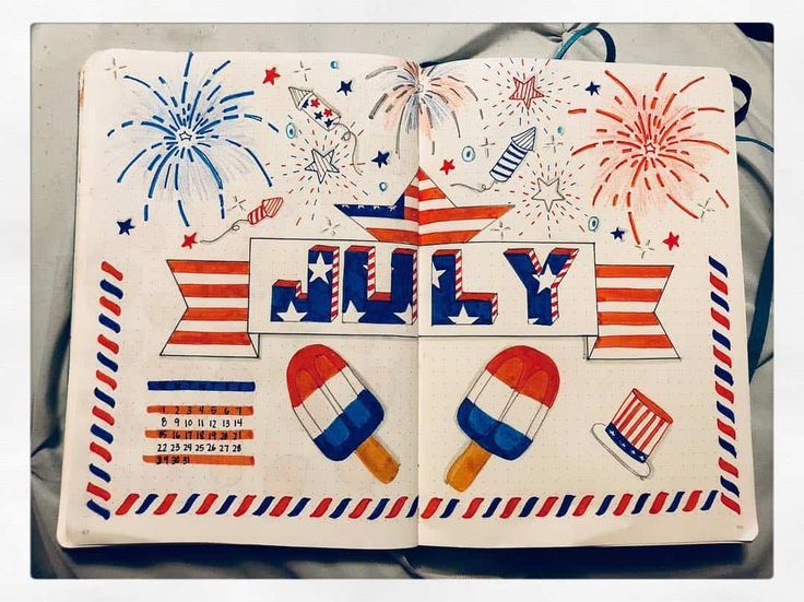 an open book with the word july written in red, white, and blue fireworks