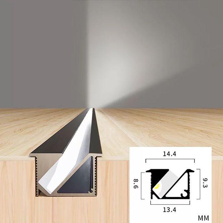 an image of a room with wood flooring and light coming in from the ceiling