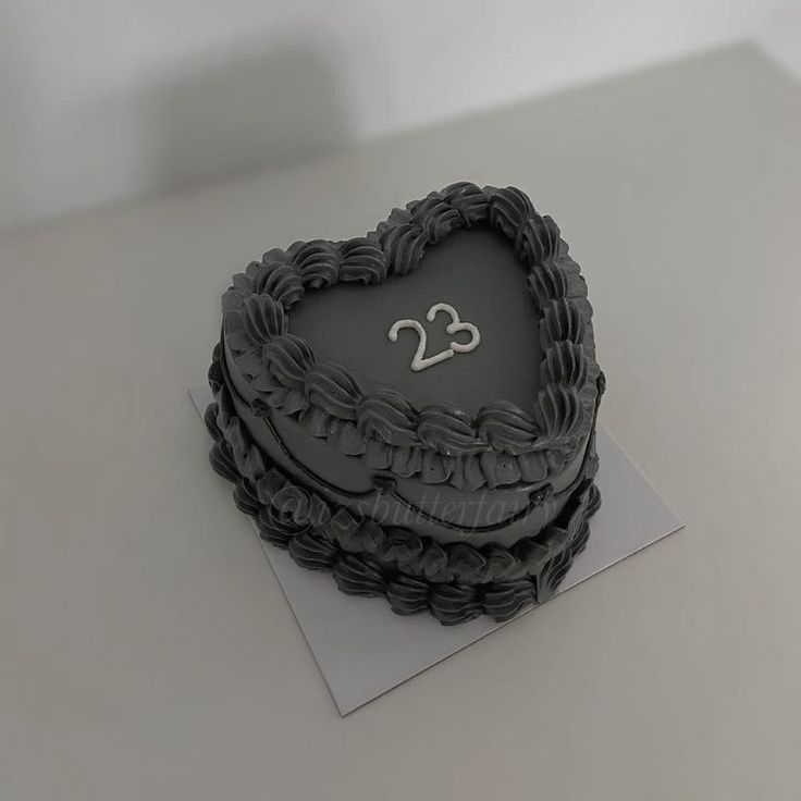 a heart shaped cake with the number twenty on it