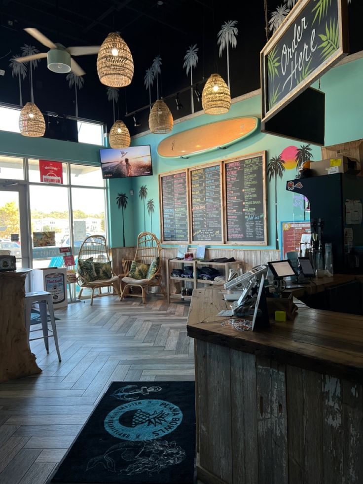 the inside of a restaurant with tables and chairs