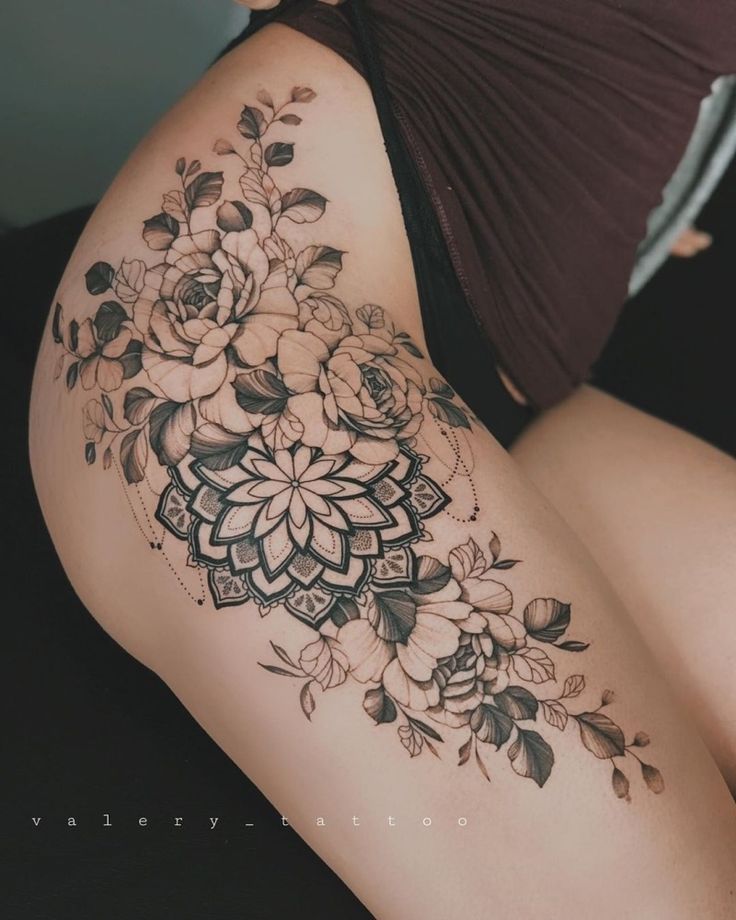 a woman's thigh with flowers on it